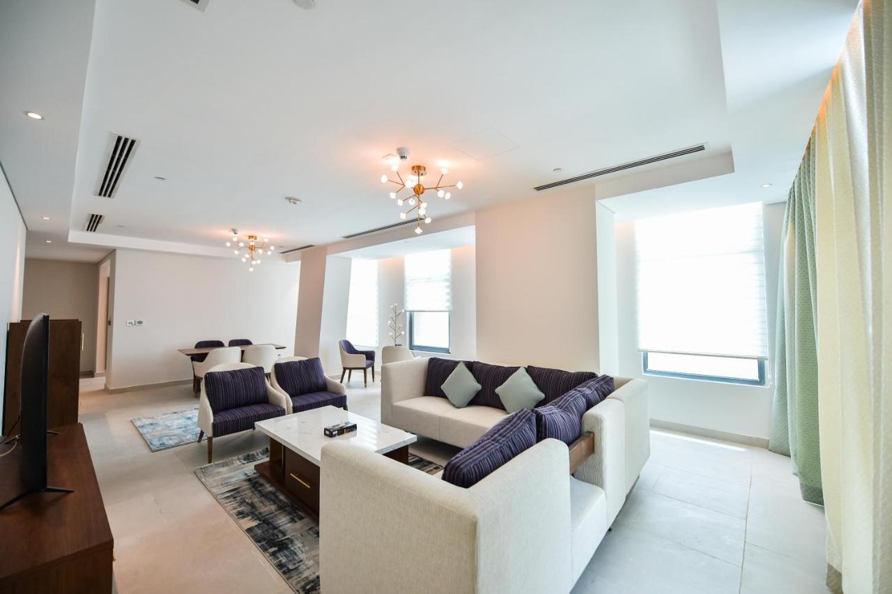 Waterfront Hotel Apartment Lusail Exterior photo A living room in a suite at the Ritz-Carlton, DIFC